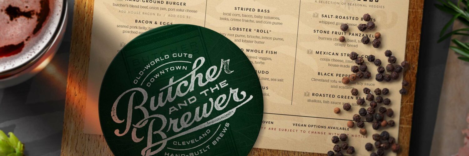 Butcher and the Brewer logo on a green circle on top of a menu
