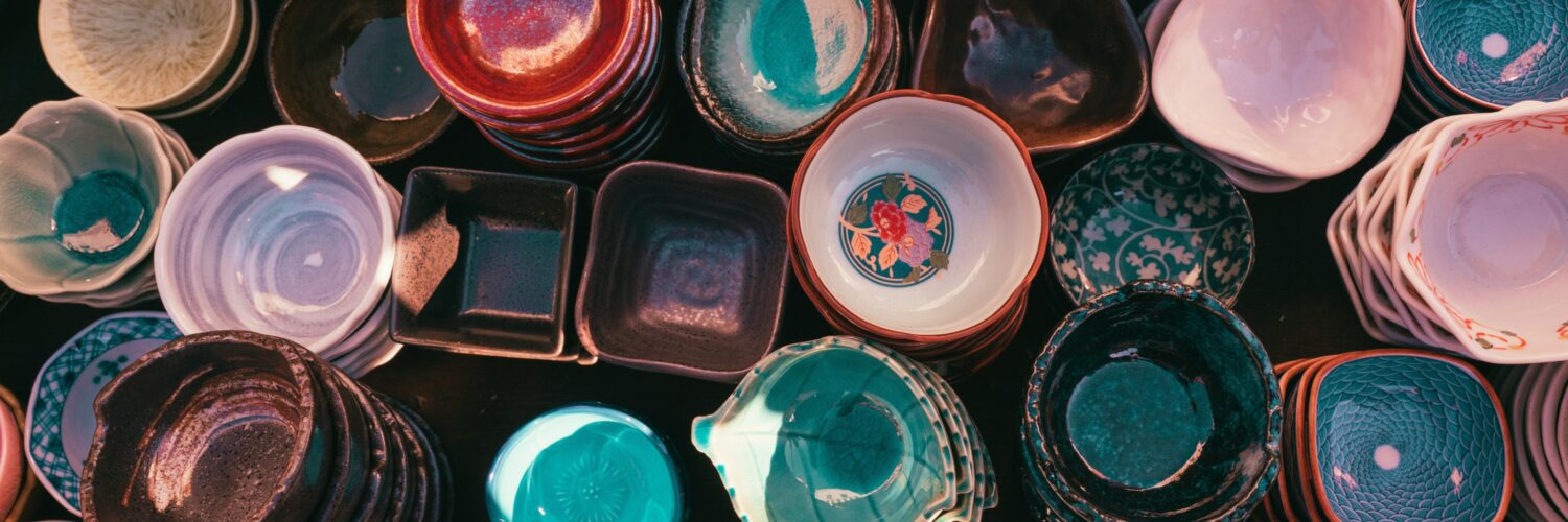Bird's eye view shot of a variety of colorful ceramic bowls